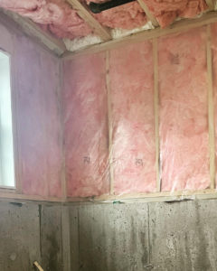 Fiberglass batt insulation in walls and ceiling of a home